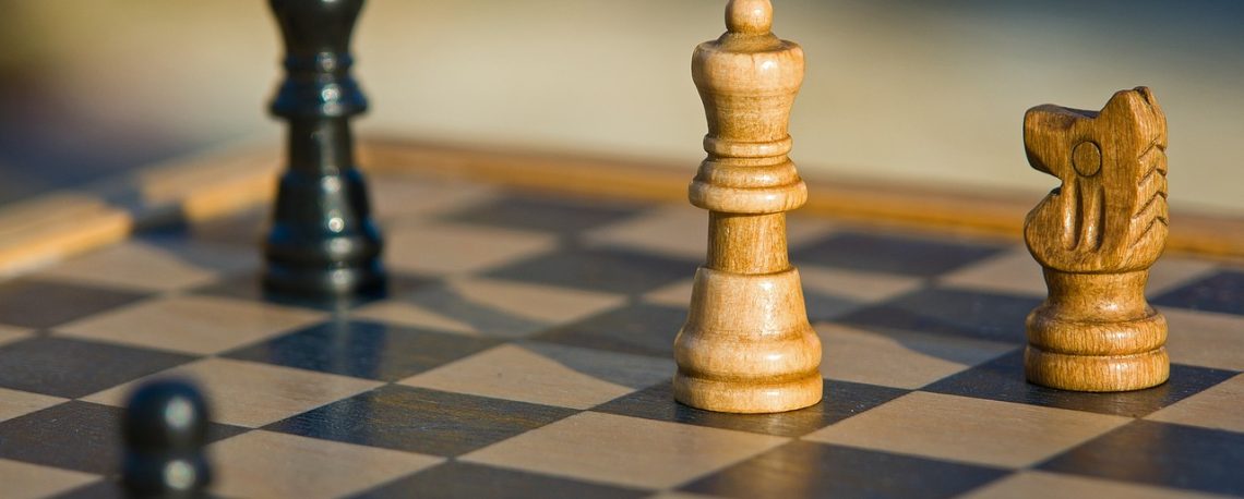 A chessboard with some chess pieces