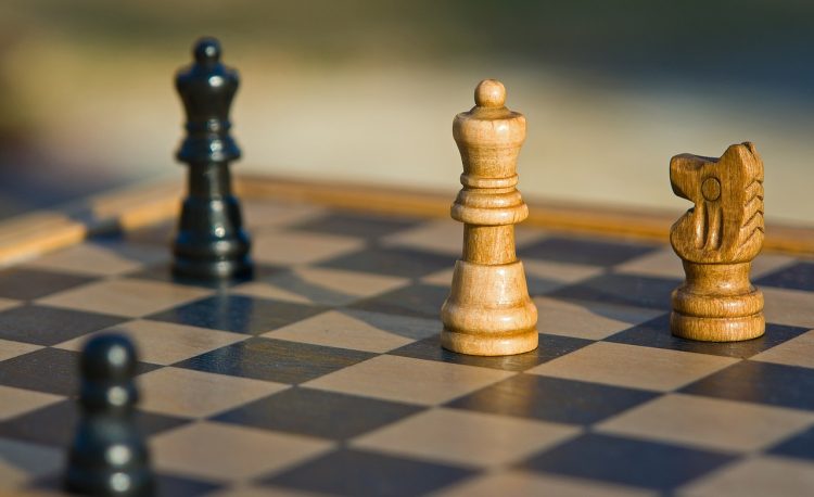 A chessboard with some chess pieces