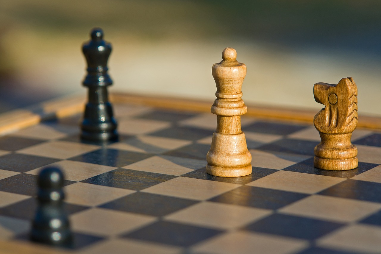 A chessboard with some chess pieces